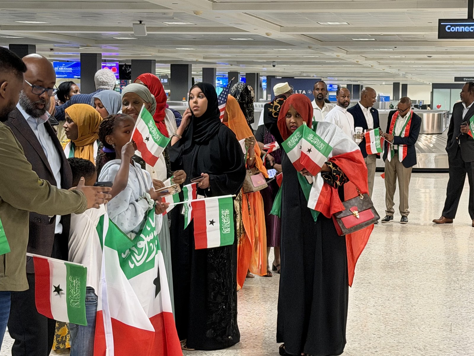 Community members greeting the President's delegation